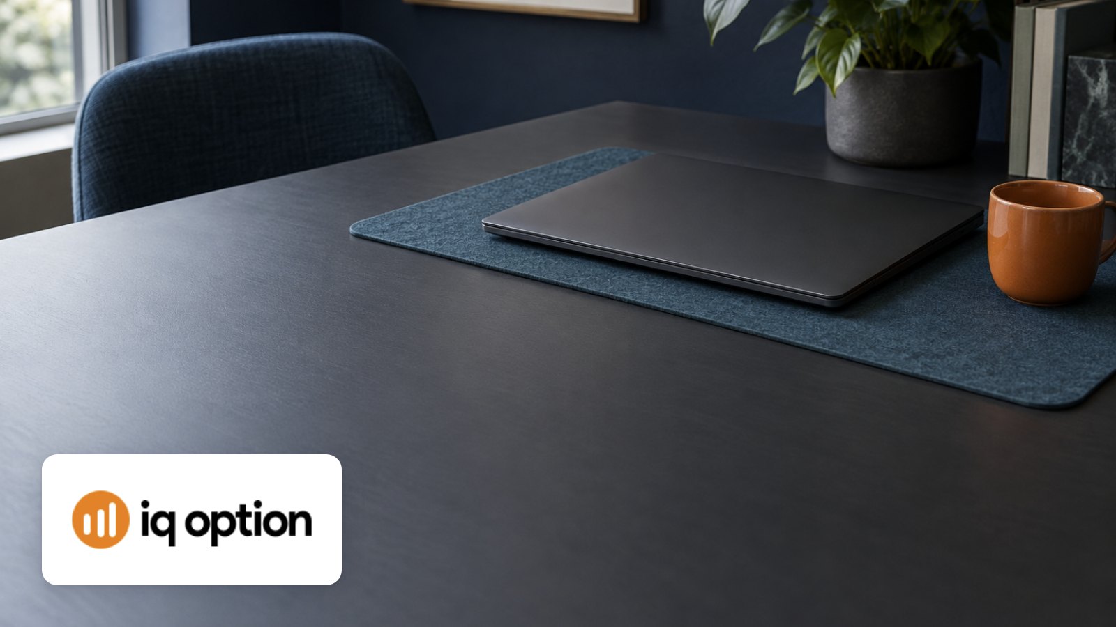 IQ Option logo with laptop on orchid coloured paper