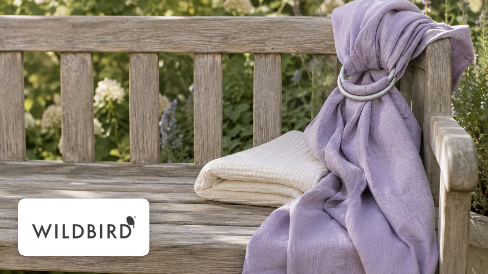 WildBird logo with soft baby blanket on a coastal hotel terrace